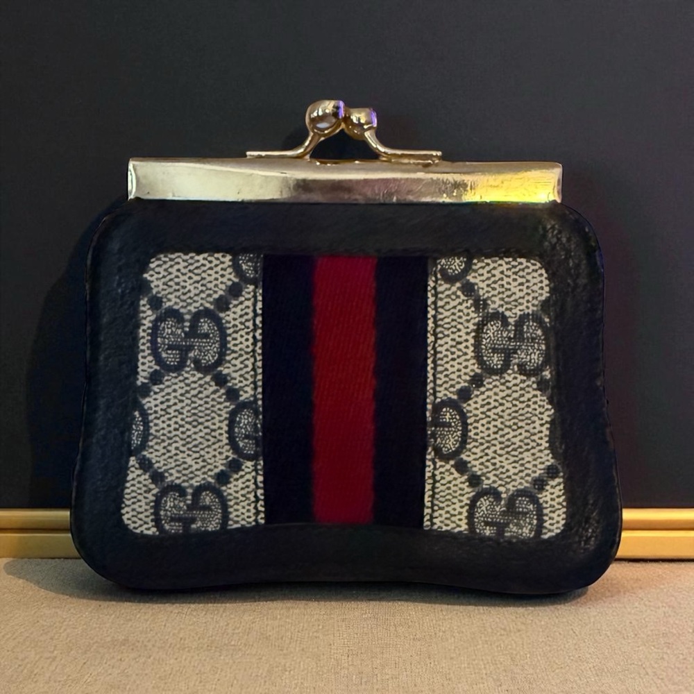 Vintage Gucci Black and Red Clutch with Monogram Design coin purse.